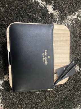 kate spade black leather zip wristlet with gold logo